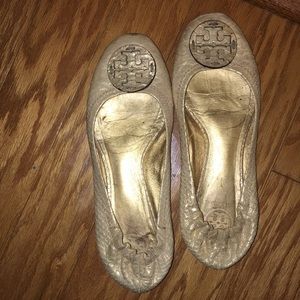 Gold Tory Burch flats.